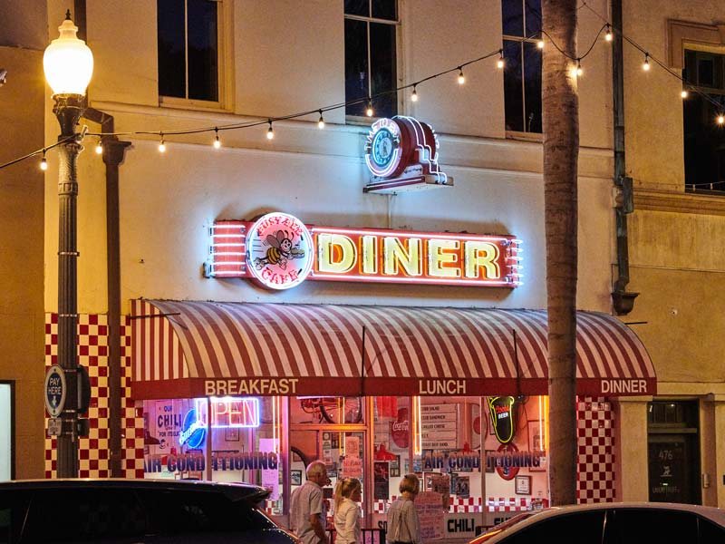 Neon sign and striped awning