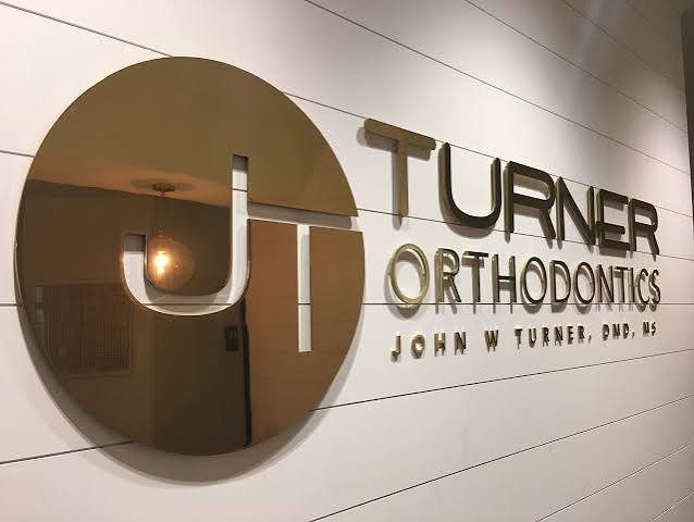 Mirror-gold lobby sign